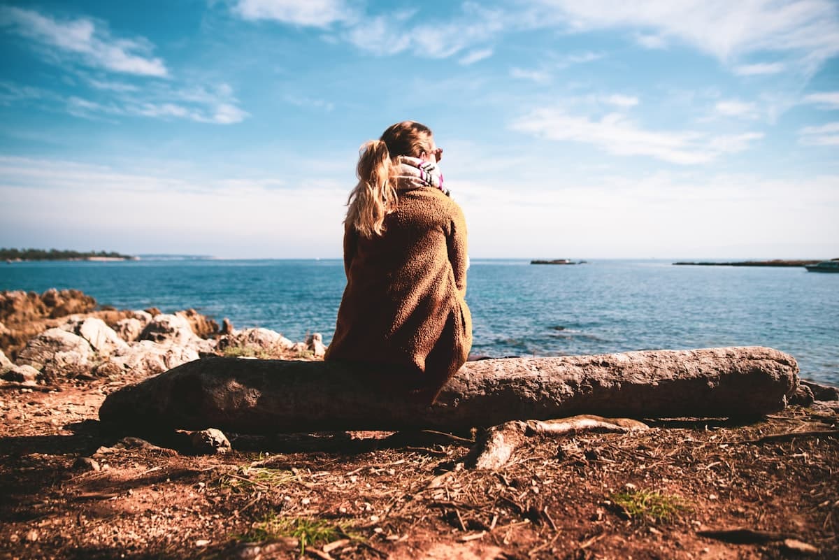 A person taking a quiet, reflective moment during depression therapy in Alberta
