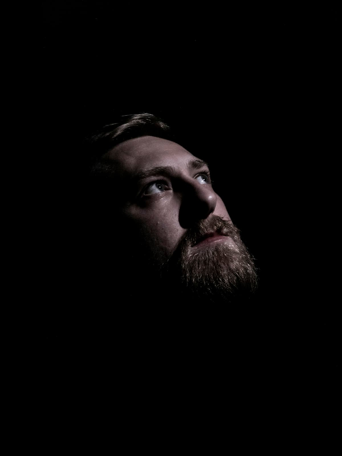 A first responder emerging into light, symbolizing trauma recovery in Alberta